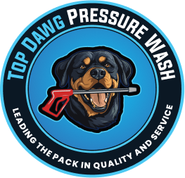 Circular logo for "Top Dawg Pressure Wash" featuring a Rottweiler holding a red pressure washer nozzle, with the slogan "Leading the Pack in Quality and Service.